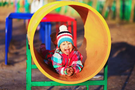The Children happy outdoors play in playground.の写真素材