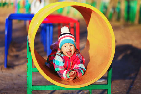 The Children happy outdoors play in playground.の写真素材