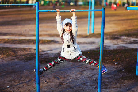 The Children happy outdoors play in playground.