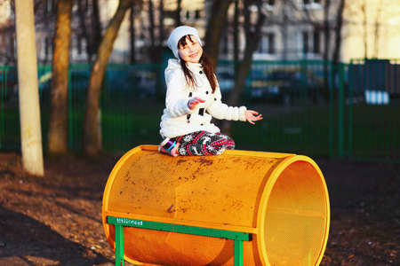 The Children happy outdoors play in playground.の写真素材