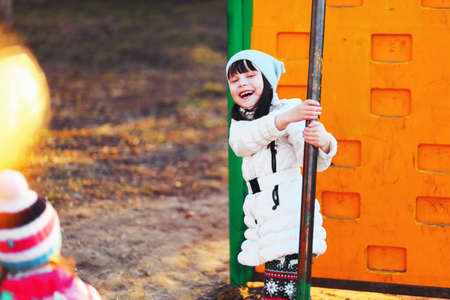 The Children happy outdoors play in playground.の写真素材