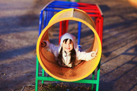 The Children happy outdoors play in playground.の写真素材