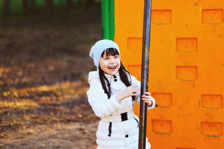The Children happy outdoors play in playground.の写真素材