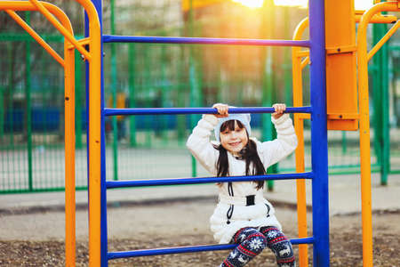 The Children happy outdoors play in playground.の写真素材