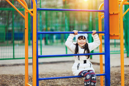The Children happy outdoors play in playground.の写真素材
