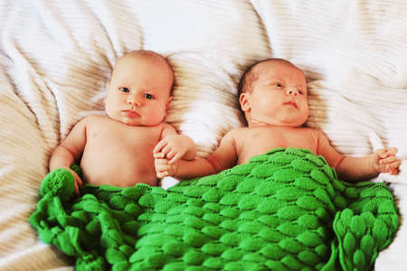 A little baby lies in the crib.の写真素材