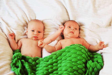 A little baby lies in the crib.の写真素材