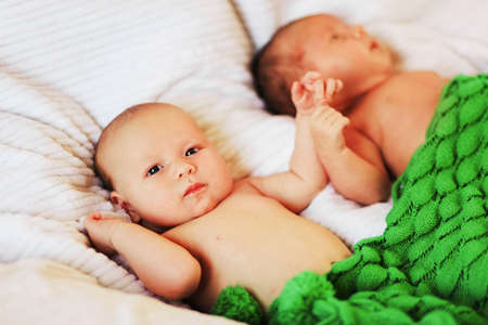 A little baby lies in the crib.の写真素材