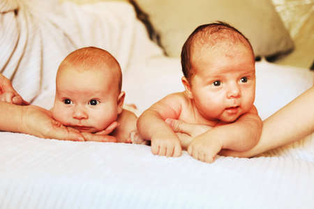 A little baby lies in the crib.の写真素材