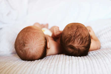 A little baby lies in the crib.の写真素材