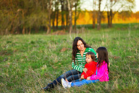 The Family happy outdoor rest a river.の写真素材