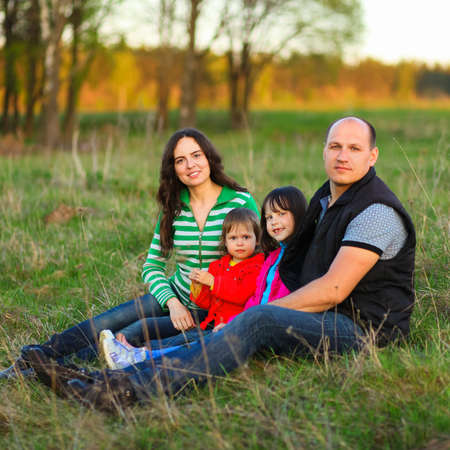 The Family happy outdoor rest a river.の写真素材