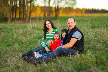 The Family happy outdoor rest a river.の写真素材
