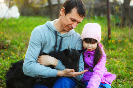 The Family happy outdoor rest a goat.の写真素材