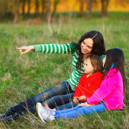 The Family happy outdoor rest a river.の写真素材