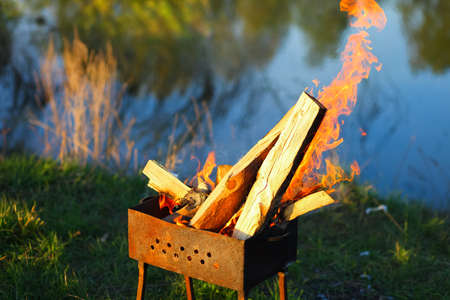 The fire erupted in the barbecue close up.の写真素材