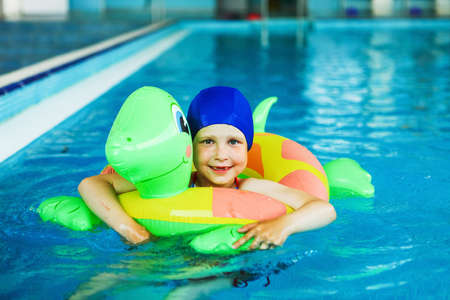 The Children swim in the pool blue.の写真素材