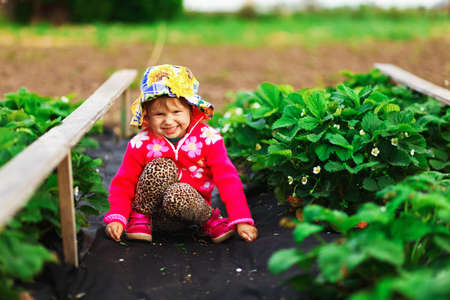 The children happy outdoors in the garden.の写真素材