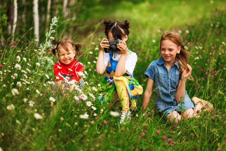 Children pictures of flowers on the meadow.の写真素材