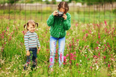 Children pictures of flowers on the meadow.の写真素材