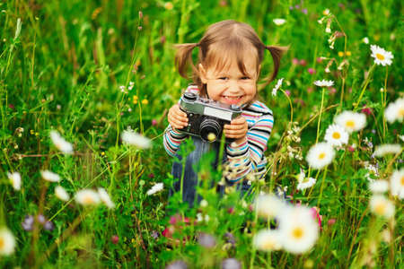 Child pictures of flowers on the meadow.の写真素材