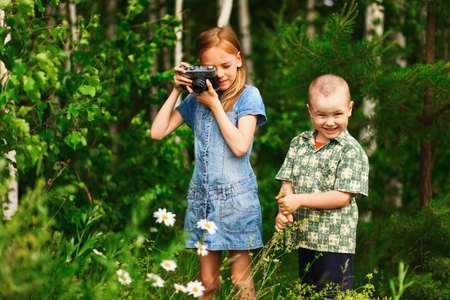 Children pictures of flowers on the meadow.の写真素材