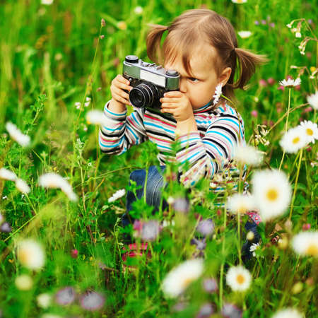 Child pictures of flowers on the meadow.の写真素材