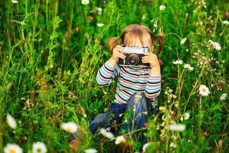 Child pictures of flowers on the meadow.の写真素材
