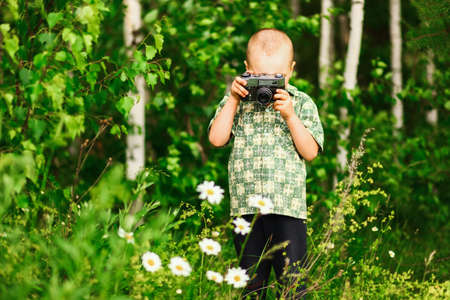 Child pictures of flowers on the meadow.の写真素材