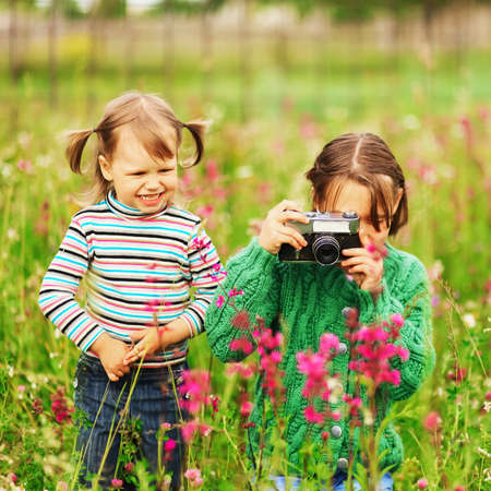 Children pictures of flowers on the meadow.の写真素材
