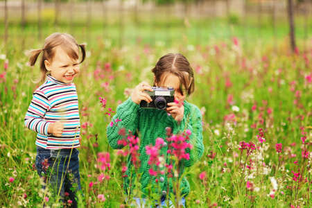 Children pictures of flowers on the meadow.の写真素材