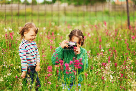 Children pictures of flowers on the meadow.の写真素材