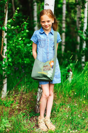 Cute portrait of a girl in the field.の写真素材