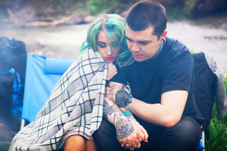 The Love story of young people outdoors.の写真素材