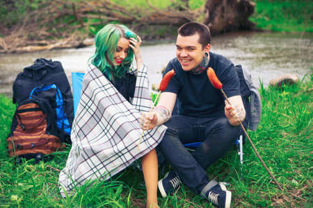 The Love story of young people outdoors.の写真素材