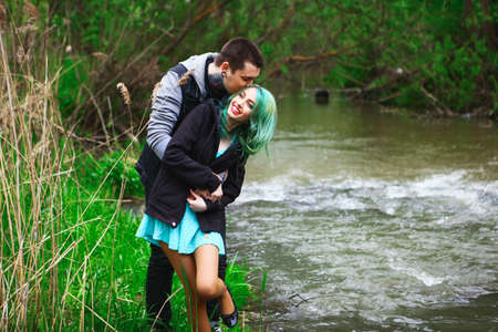 The Love story of young people outdoors.の写真素材