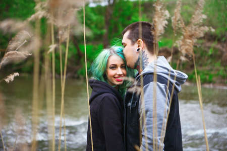 The Love story of young people outdoors.の写真素材