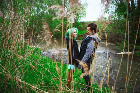 The Love story of young people outdoors.の写真素材