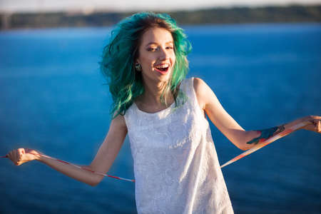 The Portrait of young woman a outdoors.の写真素材