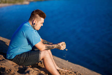 The Portrait of young man a outdoors.の写真素材