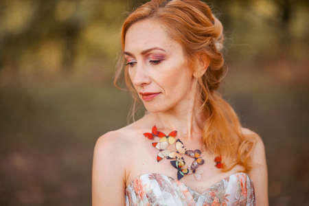 The adult woman in a beautiful dress.の写真素材