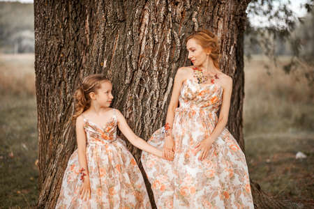 The Mother and daughter in matching dresses.の写真素材