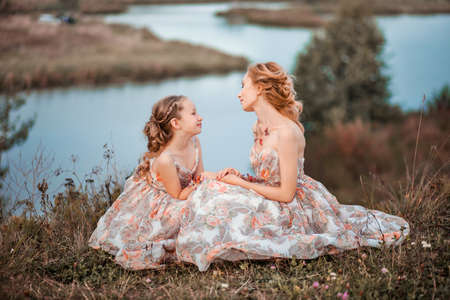 The Mother and daughter in matching dresses.の写真素材