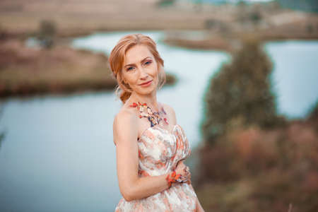 The adult woman in a beautiful dress.の写真素材