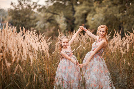 The Mother and daughter in matching dresses.の写真素材