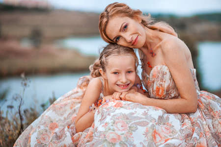 The Mother and daughter in matching dresses.の写真素材