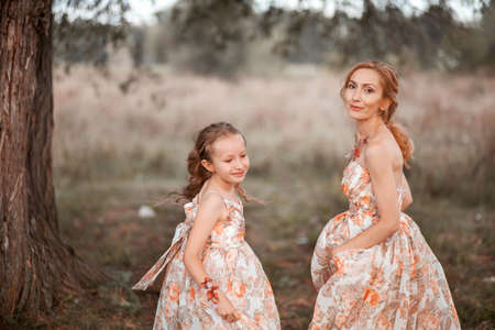 The Mother and daughter in matching dresses.の写真素材
