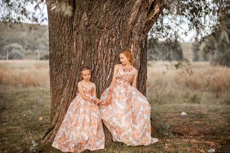 The Mother and daughter in matching dresses.の写真素材