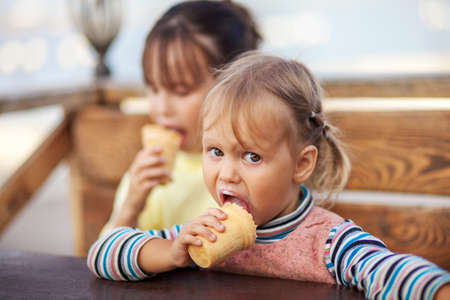 The Little girl eating a ice cream.の写真素材
