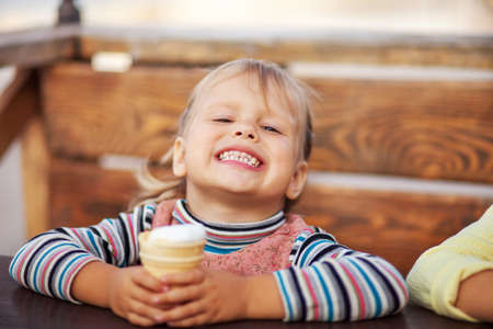 The Little girl eating a ice cream.の写真素材